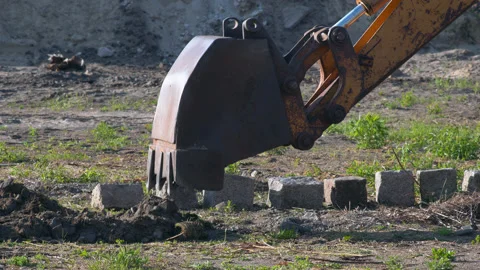Excavator digging into soil Stock Footage 132027543