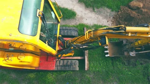 Excavator digging a trench for laying cables Stock Footage 63782937