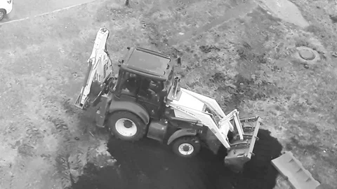 Excavator digging video, backhoe loader, excavation work at a construction site. Stock Footage 129469433