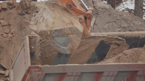 An excavator digs the ground at a construction site Stock Footage 147178433