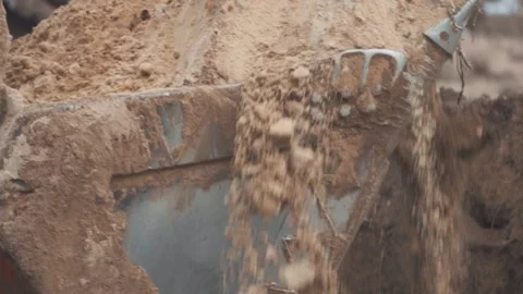 An excavator digs the ground at a construction site Stock Footage 147178637