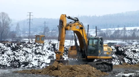 Excavator digs the ground Stock Footage 61543973