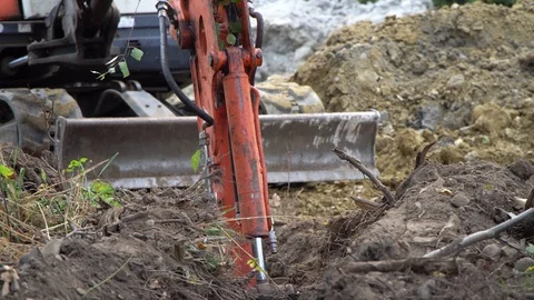 The excavator digs into the ground Stock Footage 118255083