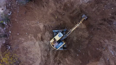 Excavator digs the ground Stock Footage 168552602