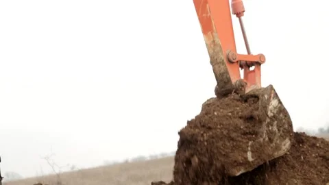 The excavator digs the ground Stock Footage 171281918