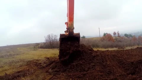 The excavator digs the ground. View from the cab of the excavator driver Stock Footage 171282021