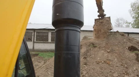 Excavator digs a hole  Stock Footage 44682704