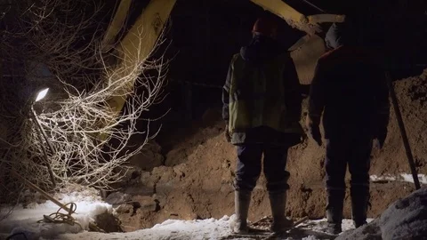 Excavator digs a hole night Stock Footage 72451326