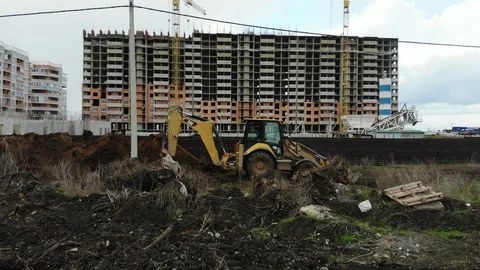 Excavator digs a trench at a construction site. Stock Footage 125345004