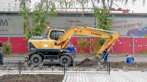 Excavator digs a trench Stock Footage 55477508