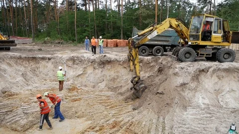 Excavator digs a trench for the foundation. Stock Footage 100365864