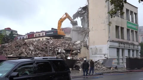 Excavator disassembles the house Stock Footage 217728755