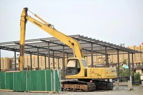 Excavator doing building construction Stock Photos