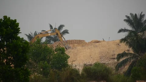 An excavator is doing earthworks Stock Footage 253421017