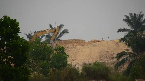 An excavator is doing earthworks Stock Footage 253421018