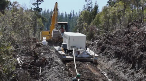 Excavator dragging pump for seismic testing for oil. Stock Footage 22943668