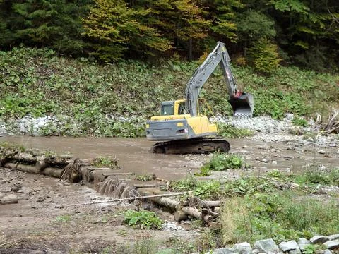 Excavator dredge a river Stock Photos