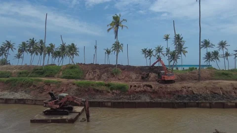 Excavator dredging sediment mud from canal in Thiruvananthapuram, Kerala Stock Footage 203880360