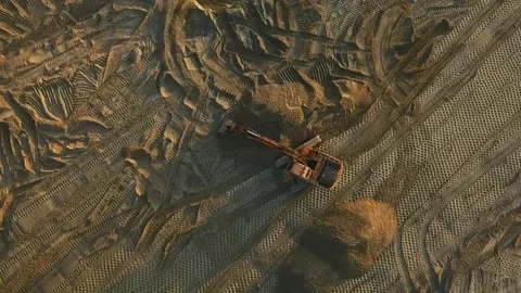 Excavator evens sand surface at construction site during sunset Stock Footage 162754420