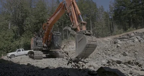 Excavator excavating rock construction site Stock Footage 77308196