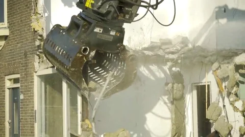 Excavator extracts window frame - 4K Stock Footage 69168658