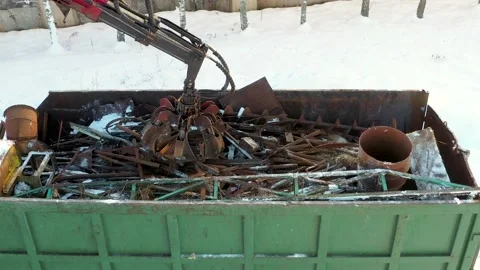 Excavator Grabs Scrap Metal With Grab For Recycling Remelting At A Landfill Stock Footage 229933652