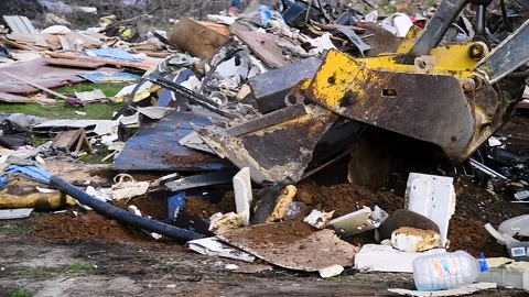 Excavator helps to clean up an illegal garbage dump Видео 238470077