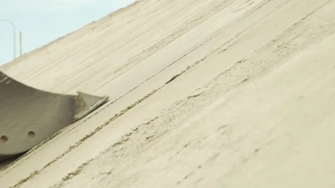 Excavator leveling the roadside with a bucket Stock Footage 285137942