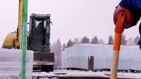 Excavator lifting large ice cubes Video stock 72772674