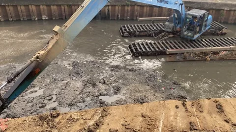 Excavator is lifting sediment Stock Footage 295028772