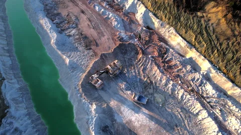 Excavator load limestone in mining truck in open pit mine. Video stock 186462379