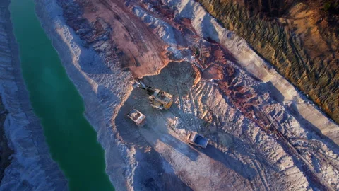 Excavator load limestone in mining truck in open pit mine. Video stock 186463767