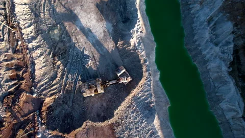 Excavator load limestone in mining truck in open pit mine. Видео 186466343