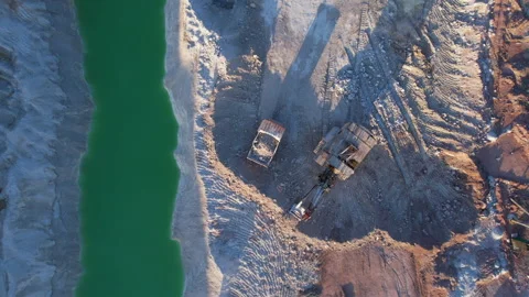 Excavator load limestone in mining truck in open pit mine. 스톡 동영상 186478235