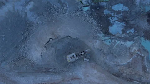 Excavator load limestone in mining truck in open pit mine. Video stock 186482847