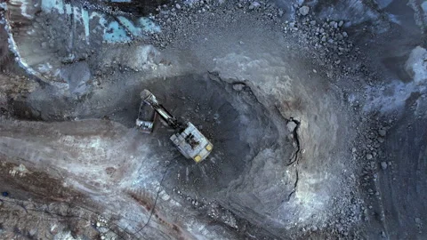Excavator load limestone in mining truck in open pit mine. Stock Footage 186488251