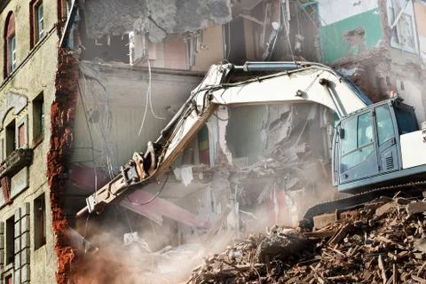 Excavator loader machine at demolition construction site Stock Photos