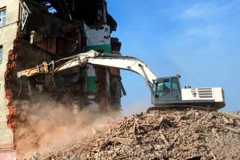 Excavator loader machine at demolition construction site Stock Photos