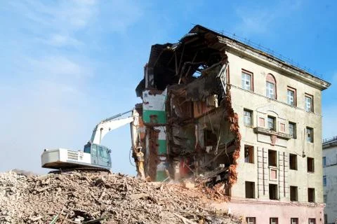Excavator loader machine at demolition construction site Stock Photos