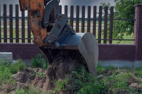 Excavator loader machine at demolition construction site. Stock Photos