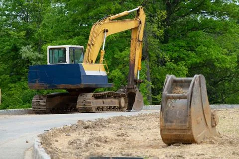 Excavator loader machine during earthmoving works outdoors large big Stock Photos