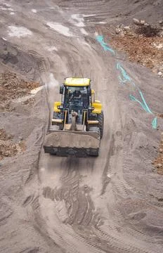 Excavator loader machine during earthmoving works Stock Photos