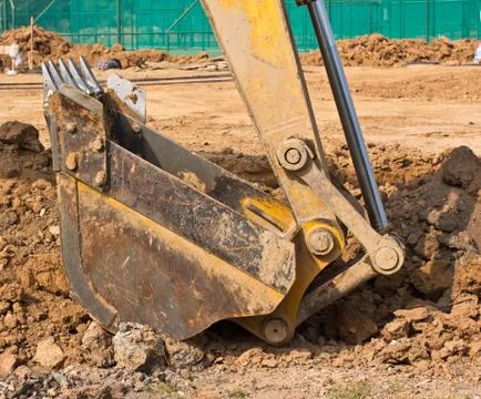 Excavator loader machine during works outdoor at construction site Stock Photos