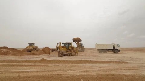 Excavator Loading And Moving Sand Video stock 62086504