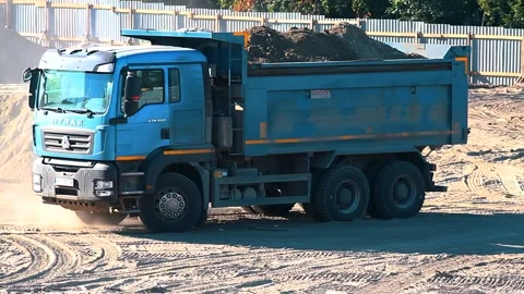 The excavator loading crushed stone into a dump truck in a crushed stone quarry Stock Footage 228718837