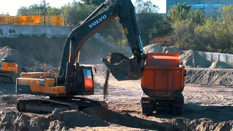 The excavator loading crushed stone into a dump truck in a crushed stone quarry Video stock 228718897