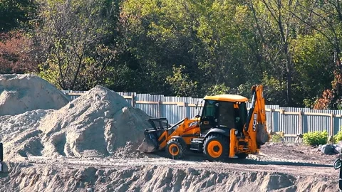 The excavator loading crushed stone into a dump truck in a crushed stone quarry Stock Footage 228719148