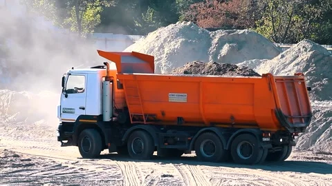 The excavator loading crushed stone into a dump truck in a crushed stone quarry Stock Footage 228719184