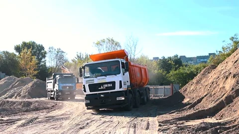 The excavator loading crushed stone into a dump truck in a crushed stone quarry Stock Footage 228719393