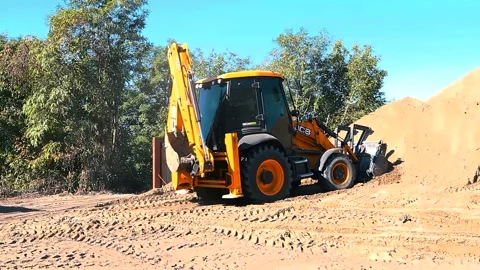 The excavator loading crushed stone into a dump truck in a crushed stone quarry Stock Footage 228733178